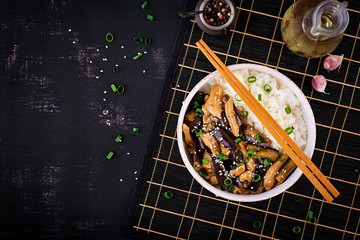 Stir fry with chicken, eggplant and boiled rice - Chinese food. Top view