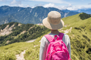 Asian climbing woman look far away