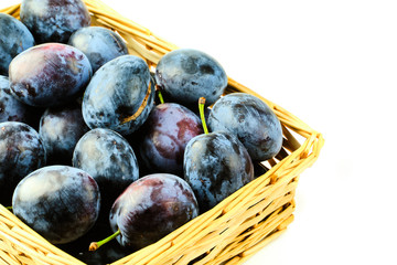 Plums in basket