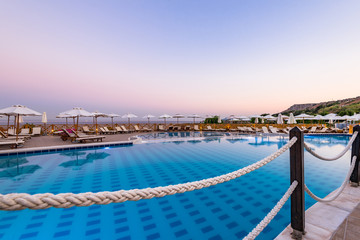 Luxury Swimming Pool at Sunrise in Hotel Resort, Rhodes, Greece