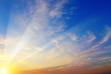 Sky and bright sun rise over the horizon.