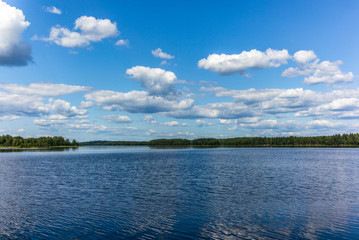 White clouds reflecting on the calm waters of the Saimaa lake in the Linnansaari National Park in Finland - 2