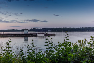 A traditional lifeguard and changing dress shelter on a wooden pier near the town of Porvoo in Finland at sunset in summer - 5