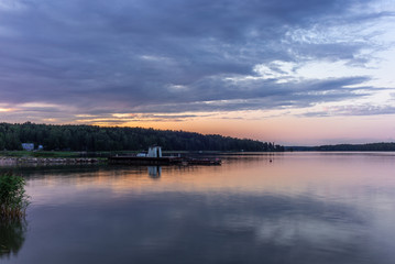 A traditional lifeguard and changing dress shelter on a wooden pier near the town of Porvoo in Finland at sunset in summer - 7