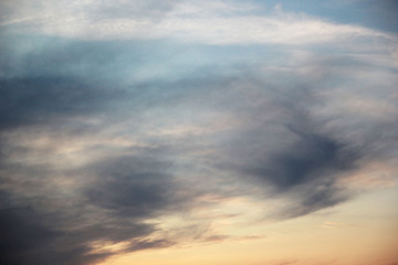 Obraz premium Sunset sky with clouds in pastel pink-purple colors