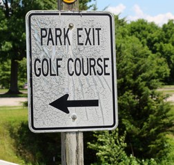 A close view on a park black and white information sign.