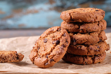 Chocolate oatmeal chip cookies on the rustic wooden table.