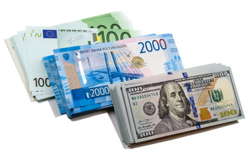 Fototapeta na wymiar Bundles money in three currencies