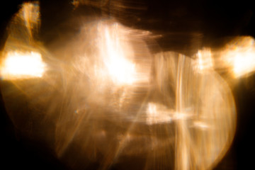 Lens Flare. Light over black background. Easy to add overlay or screen filter over photos. Abstract sun burst with digital lens flare background. Gleams rounded and hexagonal shapes, rainbow halo.
