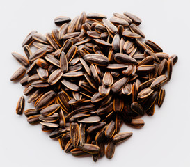 Abstract close up sunflower seeds on the white isolated background and wallpaper
