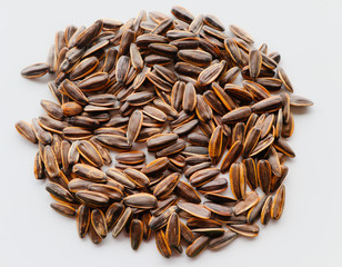 Abstract close up sunflower seeds on the white isolated background and wallpaper