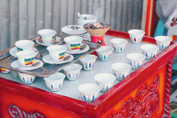 Traditional cup of Ethopian coffee served with aromatic essence. Ceremony use frankincense and...