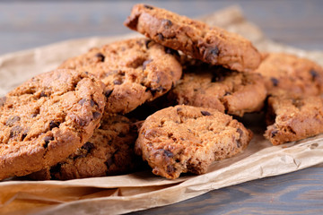 Chocolate oatmeal chip cookies on the rustic wooden table. close-up
