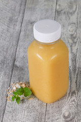 Dietary vegetarian oats milk over wooden