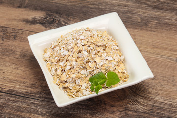 Raw oats in the bowl