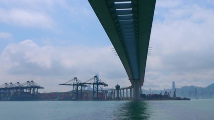 Time lapse of industrial port with containers ship in the harbor at Hong Kong city