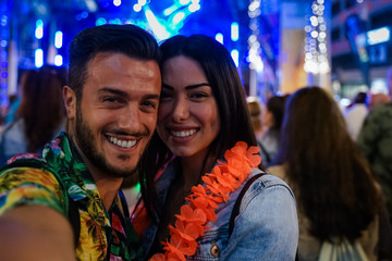 Boyfriend and girlfriend at first date. Happy couple of lovers at beginning of love story . Man and young woman having fun at the party . Funny and love concept. Image