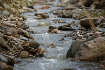 Photo of mountain stream, stones