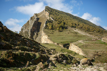 Photo of mountain area with blue cloudy sky summer