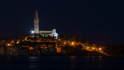 Fototapeta na wymiar The city of Rovinj at night over the bay.