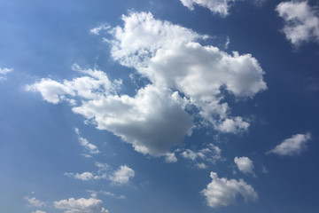 Beautiful clouds against a blue sky background. Cloud sky. Blue sky with cloudy weather, nature cloud. White clouds, blue sky and sun