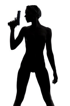 recommend clip art: Silhouette of slim woman with gun on dark background. Suicide, revenge, lifestyle,sexual killer concept. isolated white background. studio shot
