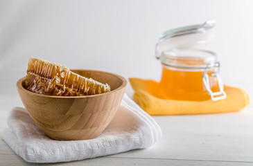 fresh honey and honeyons on a white background