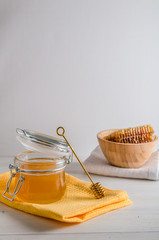 fresh honey and honeyons on a white background with copy space