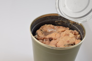 Open Can of Wild-Caught Salmon Off-Center on White Background