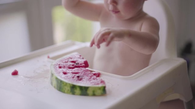 Happy child with big red slice of watermelon. Healthy eating concept