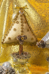 handmade Christmas tree, cushion type adorned with stonework, bow and lace with golden and silver tones, for table or home decoration