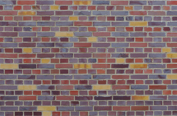 Texture of an old, weathered and colorful brick wall