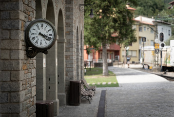 Fototapeta na wymiar Old retro wall clock at Ribes de Freser funicular train station, Catalonia, Spain.