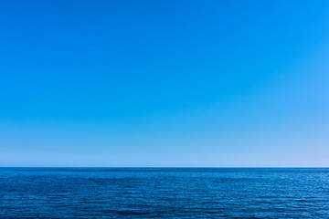 Seascape with sea horizon and blue sky