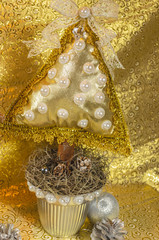 handmade Christmas tree, cushion type adorned with stonework, bow and lace with golden and silver tones, for table or home decoration