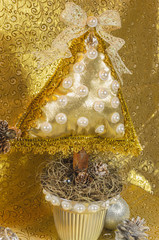 handmade Christmas tree, cushion type adorned with stonework, bow and lace with golden and silver tones, for table or home decoration