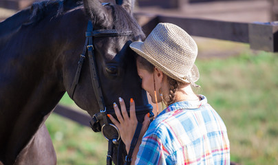 Fototapeta premium Woman and horse. Close up
