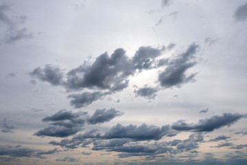 Evening sky with curly dark clouds