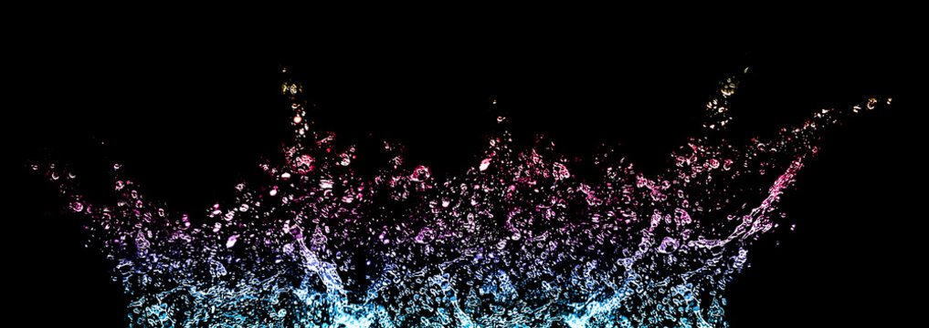 Splashes and drops of water on a black background. Rainbow tinted. Abstract or background image, selective focus. Banner