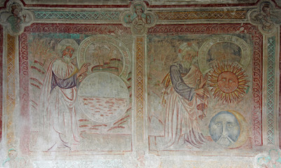 Dio separa la terra dalle acque e crea il Sole e la Luna; affresco esterno della chiesa di San...