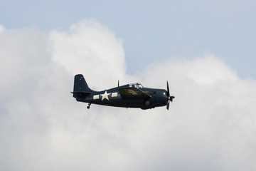 Fototapeta na wymiar old fighter jet in clouds