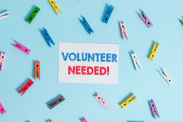 Handwriting text writing Volunteer Needed. Conceptual photo need work for organization without being paid Colored clothespin rectangle shaped reminder paper light blue background