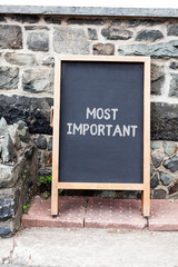 Handwriting text writing Most Important. Conceptual photo Greatest or highest degree quantity or...