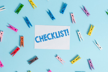 Handwriting text writing Checklist. Conceptual photo list items required things be done or points considered Colored clothespin rectangle shaped reminder paper light blue background