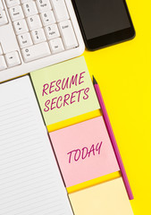 Conceptual hand writing showing Resume Secrets. Concept meaning Tips on making amazing curriculum vitae Standout Biography Empty papers with copy space on yellow background table