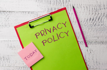 Word writing text Privacy Policy. Business photo showcasing Document that explains how an organization handles clients Metal clipboard paper sheets marker sticky notes pad wooden background