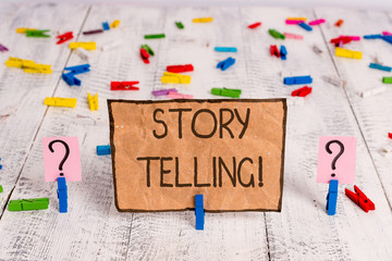 Conceptual hand writing showing Storytelling. Concept meaning activity writing stories for publishing them to public Crumbling sheet with paper clips placed on the wooden table