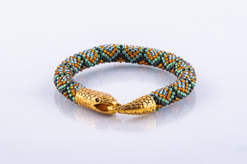 Small designer bead bracelet with snake clasp