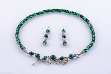 Set of necklaces and earrings made of small beads and handmade stones