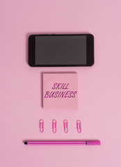 Text sign showing Skill Business. Business photo showcasing Ability to handle business venture Intellectual expertise Colored blank sticky note clips smartphone pen trendy pastel background